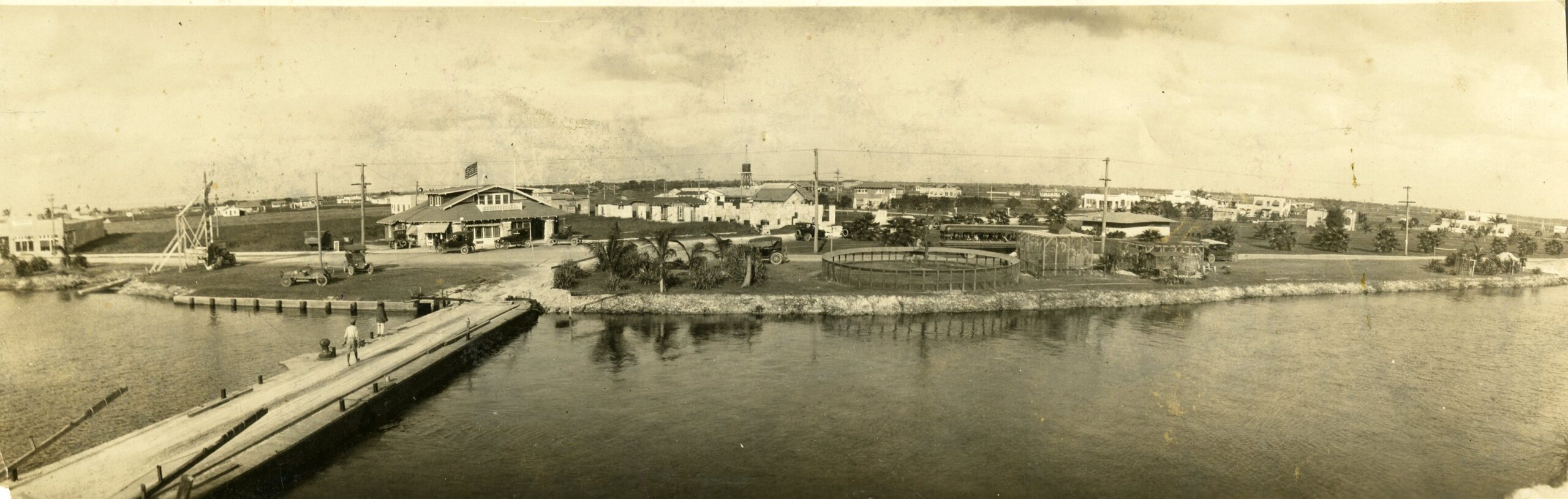 Footbridge crossing, Hialeah town and zoo with bus tour; 1922