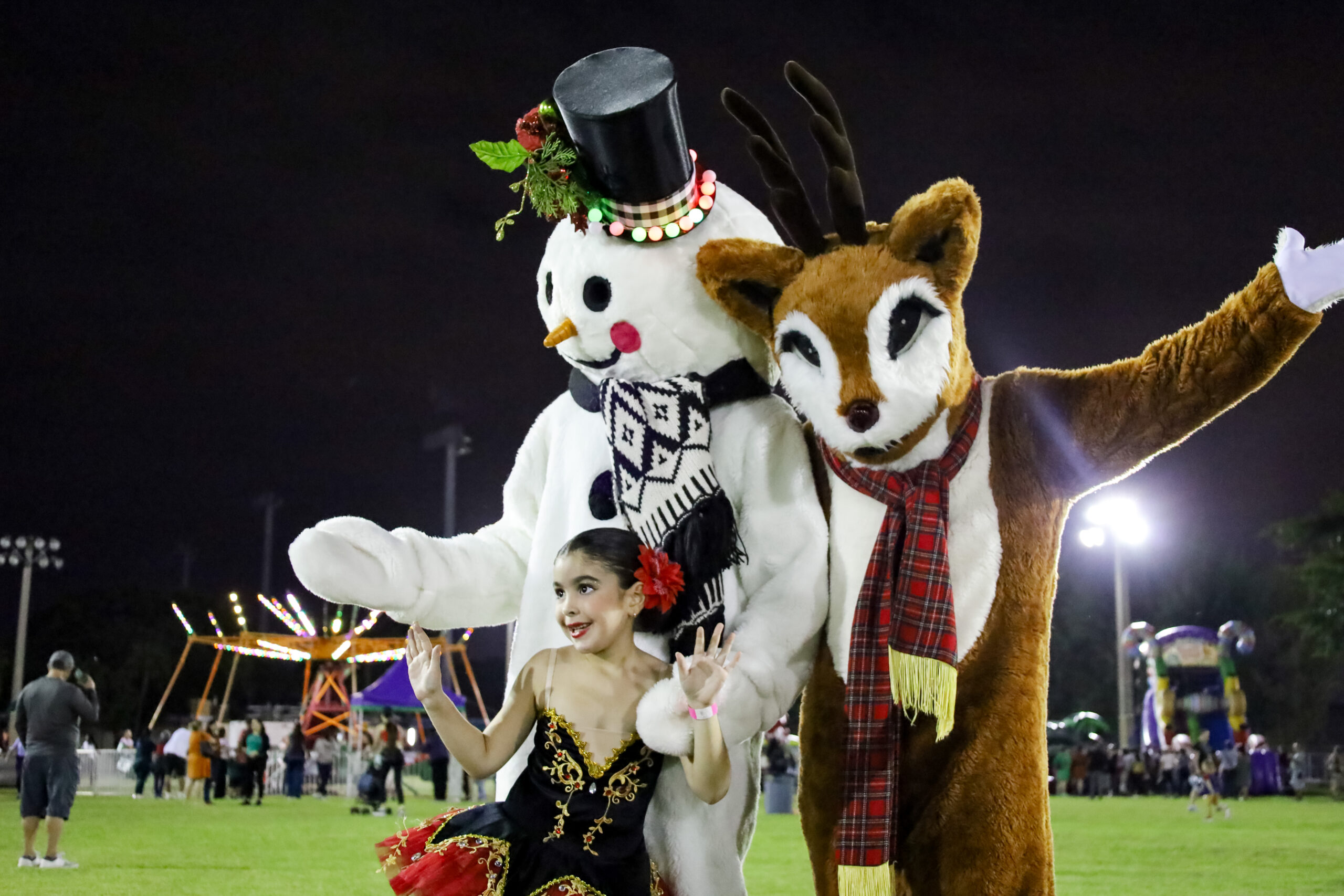 Picture of a little girl with frosty and rudolph